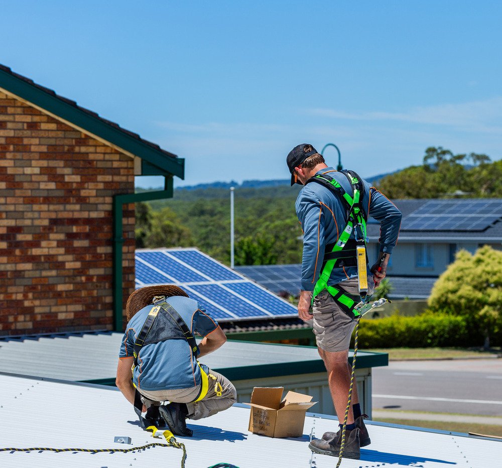 two expert roofers fixing roof in Hobart area